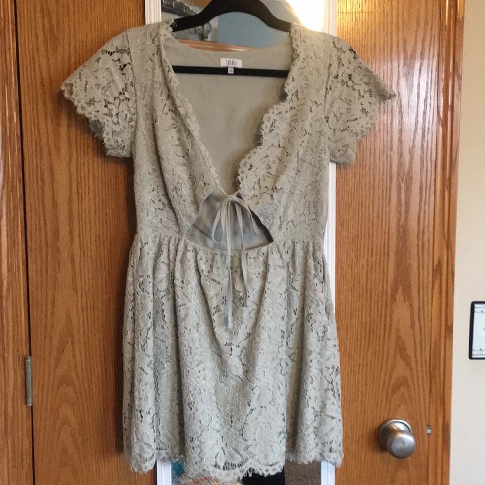 Light green lace dress with cutout
